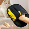 Pet grooming glove removing loose fur from a dog
